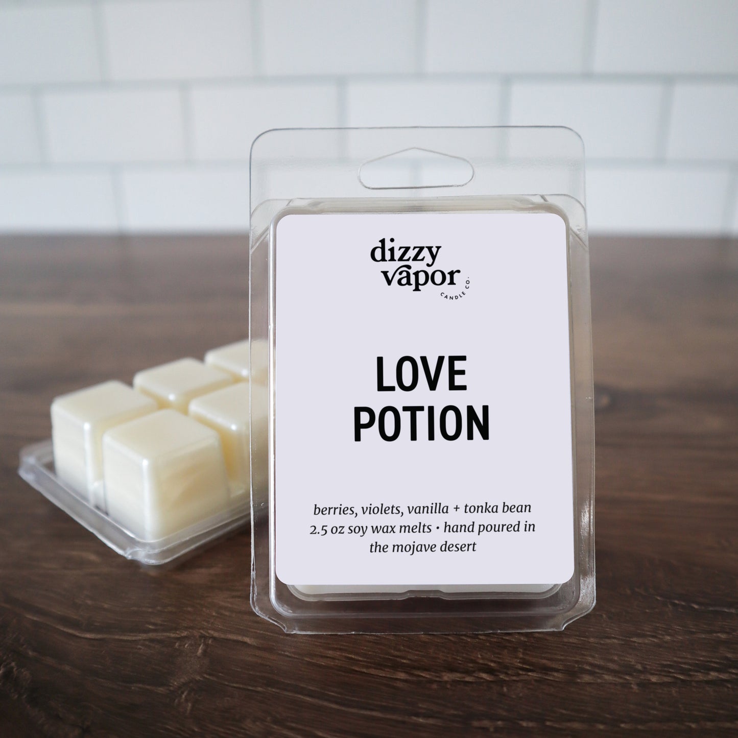 2.5 oz Tart wax in plastic packaging labeled 'Love Potion'